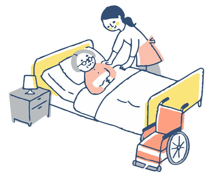 女性介護スタッフとベッドで寝る年配の女性